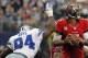 ARLINGTON, TX - SEPTEMBER 23: Josh Freeman #5 of the Tampa Bay Buccaneers looks for an open receiver under pressure from DeMarcus Ware #94 of the Dallas Cowboys at Cowboys Stadium on September 23, 2012 in Arlington, Texas. The Dallas Cowboys beat the Tampa Bay Buccaneers 16-0. (Photo by Tom Pennington/Getty Images)