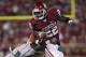 NORMAN, OK - SEPTEMBER 8: Running back Roy Finch #22 of the Oklahoma Sooners tries to escape a Florida A&M Rattler tackle on September 8, 2012 at Gaylord Family-Oklahoma Memorial Stadium in Norman, Oklahoma. Oklahoma won 69-13. (Photo by Brett Deering/Getty Images)