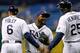 ST. PETERSBURG - OCTOBER 01: Pitcher Fernando Rodney #56 of the Tampa Bay Rays is congratulated by coaches Tom Foley #6 and George Hendrick #25 after his save against the Baltimore Orioles at Tropicana Field on October 1, 2012 in St. Petersburg, Florida. (Photo by J. Meric/Getty Images)