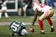 EAST RUTHERFORD, NJ - SEPTEMBER 30: Santonio Holmes #10 of the New York Jets writhes on the turf after fumbling a ball picked up by Carlos Rogers #22 of the San Francisco 49ers during a game at MetLife Stadium on September 30, 2012 in East Rutherford, New Jersey. (Photo by Jeff Zelevansky/Getty Images)