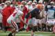 CHAMPAIGN, IL - NOVEMBER 19: Jon Davis #3 of the Illinois Fighting Illini moves with the ball as Chris Borland #44 of the Wisconsin Badgers closes in at Memorial Stadium on November 19, 2011 in Champaign, Illinois. Wisconsin defeated Illinois 28-17. (Photo by Jonathan Daniel/Getty Images)