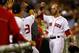 BOSTON, MA - SEPTEMBER 12: Dustin Pedroia #15 of the Boston Red Sox is congratulated by teammates in the dugout after hitting a solo home run against the New York Yankees in the fourth inning during the game on September 12, 2012 at Fenway Park in Boston, Massachusetts. (Photo by Jared Wickerham/Getty Images)
