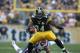 Oct 30, 2011; Pittsburgh, PA, USA; Pittsburgh Steelers running back Rashard Mendenhall (34) runs the ball past New England Patriots linebacker Rob Ninkovich (50) during the first half of the game at Heinz Field. Mandatory Credit: Jason Bridge-US PRESSWIRE