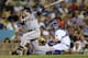 LOS ANGELES, CA - OCTOBER 01: Buster Posey #28 of the San Francisco Giants hits an RBI double in the first inning against the Los Angeles Dodgers on October 1, 2012 at Dodger Stadium in Los Angeles, California. (Photo by Stephen Dunn/Getty Images)