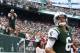 Sept. 30, 2012; East Rutherford, NJ, USA; New York Jets quarterback Mark Sanchez (6) enters the stadium as Fireman Ed cheers him on before the game against the San Francisco 49ers at MetLife Stadium. Mandatory Credit: Debby Wong-US PRESSWIRE