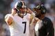 OAKLAND, CA - SEPTEMBER 23: Ben Roethlisberger #7 of the Pittsburgh Steelers talks with head coach Mike Tomlin of the Pittsburgh Steelers during their game against the Oakland Raiders at Oakland-Alameda County Coliseum on September 23, 2012 in Oakland, California. (Photo by Ezra Shaw/Getty Images)