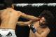 June 8, 2012; Sunrise, FL, USA; Erick SIlva (left) hits Charlie Brenneman during their UFC bout at BankAtlantic Center. Mandatory Credit: Steve Mitchell-US PRESSWIRE