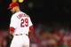 ST. LOUIS, MO - OCTOBER 2: Starter Chris Carpenter #29 of the St. Louis Cardinals checks the runner at first base against the Cincinnati Reds at Busch Stadium on October 2, 2012 in St. Louis, Missouri. (Photo by Dilip Vishwanat/Getty Images)