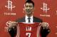 HOUSTON, TX - JULY 19: Jeremy Lin of the Houston Rockets displays his jersey during a press conference at Toyota Center on July 19, 2012 in Houston, Texas. (Photo by Bob Levey/Getty Images)