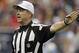 HOUSTON, TX - SEPTEMBER 30: Referee Carl Cheffers #51 calls a penalty during a football game between the Tennessee Titans and Houston Texans at Reliant Arena at Reliant Park on September 30, 2012 in Houston, Texas. (Photo by Bob Levey/Getty Images)