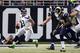 ST. LOUIS, MO - SEPTEMBER 30: Quarterback Russell Wilson #3 of the Seattle Seahawks attempts to avoid pressure from the St. Louis Rams defense during the game at the Edward Jones Dome on September 30, 2012 in St. Louis, Missouri. The Rams beat the Seahawks 19-13. (Photo by David Welker/Getty Images)