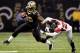 NEW ORLEANS, LA - DECEMBER 26: Running back Chris Ivory #29 of the New Orleans Saints runs the ball against cornerback Brent Grimes #20 of the Atlanta Falcons in the first half at the Mercedes-Benz Superdome on December 26, 2011 in New Orleans, Louisiana. (Photo by Chris Graythen/Getty Images)