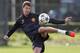 MANCHESTER, ENGLAND - OCTOBER 1: Jonny Evans takes part in a Manchester United training session at the Carrington Training Ground on October 1, 2012 in Manchester, England. (Photo by Paul Thomas/Getty Images)