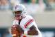 EAST LANSING, MI - SEPTEMBER 29: Braxton Miller #5 of the Ohio State Buckeyes looks to make a second quarter pass while playing the Michigan State Spartans at Spartan Stadium on September 29, 2012 in East Lansing, Michigan. (Photo by Gregory Shamus/Getty Images)