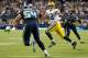 Sep 24, 2012; Seattle, WA, USA; Green Bay Packers quarterback Aaron Rodgers (12) looks for an open receiver while running from Seattle Seahawks middle linebacker Bobby Wagner (54) during the 2nd half at CenturyLink Field. Seattle defeated Green Bay 14-12. Mandatory Credit: Steven Bisig-US PRESSWIRE