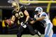 NEW ORLEANS, LA - JANUARY 07: Jimmy Graham #80 of the New Orleans Saints makes a catch against Louis Delmas #26 of the Detroit Lions during their 2012 NFC Wild Card Playoff game at Mercedes-Benz Superdome on January 7, 2012 in New Orleans, Louisiana. (Photo by Kevin C. Cox/Getty Images)