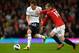 MANCHESTER, ENGLAND - SEPTEMBER 29: Gylfi Sigurdsson of Tottenham Hotspur and Wayne Rooney of Manchester United battle for the ball during the Barclays Premier League match between Manchester United and Tottenham Hotspur at Old Trafford on September 29, 2012 in Manchester, England. (Photo by Shaun Botterill/Getty Images)