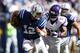 INDIANAPOLIS, IN - SEPTEMBER 16: Andrew Luck #12 of the Indianapolis Colts gets pressured by Everson Griffen #97 of the Minnesota Vikings during the game at Lucas Oil Stadium on September 16, 2012 in Indianapolis, Indiana. The Colts won 23-20. (Photo by Joe Robbins/Getty Images)