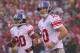 SAN FRANCISCO, CA - JANUARY 22: (L-R) Victor Cruz #80 and Eli Manning #10 of the New York Giants walk back to the sideline after a Giant fumbled the ball i n the first quarter against the San Francisco 49ers during the NFC Championship Game at Candlestick Park on January 22, 2012 in San Francisco, California. (Photo by Doug Pensinger/Getty Images)