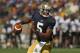 SOUTH BEND, IN - SEPTEMBER 08: Everett Golson #5 of the Notre Dame Fighting Irish rolls out to look for a receiver against the Purdue Boilermakers at Notre Dame Stadium on September 8, 2012 in South Bend, Indiana. Notre Dame defeated Purdue 21-17. (Photo by Jonathan Daniel/Getty Images)