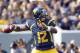 MORGANTOWN, WV - SEPTEMBER 29: Geno Smith #12 of the West Virginia Mountaineers drops back to pass against the Baylor Bears during the game on September 29, 2012 at Mountaineer Field in Morgantown, West Virginia. (Photo by Justin K. Aller/Getty Images)