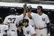 Oct. 2, 2012; Bronx, NY, USA; New York Yankees left fielder Raul Ibanez (27) high fives shortstop Derek Jeter (2) after hitting a two-run home run during the ninth inning against the Boston Red Sox at Yankee Stadium. Yankees win 4-3 in 12 innings. Mandatory Credit: Debby Wong-US PRESSWIRE