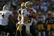 GREEN BAY, WI - SEPTEMBER 30: Drew Brees #9 of the New Orleans Saints looks for a receiver against the Green Bay Packers at Lambeau Field on September 30, 2012 in Green Bay, Wisconsin. The Packers defeated the Saints 28-27. (Photo by Jonathan Daniel/Getty Images)