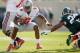 EAST LANSING, MI - SEPTEMBER 29: Braxton Miller #5 of the Ohio State Buckeyes looks to get around the tackle of Denicos Allen #28 of the Michigan State Spartans at Spartan Stadium on September 29, 2012 in East Lansing, Michigan. Ohio State won the game 17-16. (Photo by Gregory Shamus/Getty Images)