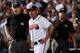 Braves manager Fredi Gonzalez deliberates with 3B umpire Jeff Nelson. Left field umpire Sam Holbrook, who made the infield fly call, is pictured in the background.