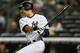 NEW YORK, NY - OCTOBER 02: Derek Jeter #2 of the New York Yankees hits a double against the Boston Red Sox on October 2, 2012 at Yankee Stadium in the Bronx borough of New York City. (Photo by Elsa/Getty Images)