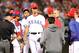 ARLINGTON, TX - OCTOBER 05: Starting pitcher Yu Darvish (C) #11 of the Texas Rangers takjs with players, umpires and coaches on the mound in the top of the sixth inning against the Baltimore Orioles during the American League Wild Card playoff game at Rangers Ballpark in Arlington on October 5, 2012 in Arlington, Texas. (Photo by Ronald Martinez/Getty Images)