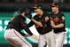 ARLINGTON, TX - OCTOBER 05: (L-R) Chris Davis #19, Manny Machado #13 and J.J. Hardy #2 of the Baltimore Orioles celebrate after they won 5-1 against the Texas Rangers during the American League Wild Card playoff game at Rangers Ballpark in Arlington on October 5, 2012 in Arlington, Texas. (Photo by Ronald Martinez/Getty Images)