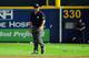 ATLANTA, GA - OCTOBER 05: Umpire Rob Drake reacts after bottles and cups are thrown on the field by fans after the home fans disagree with an infield fly ruling on a ball hit by Andrelton Simmons #19 of the Atlanta Braves in the eighth inning while taking on the St. Louis Cardinals during the National League Wild Card playoff game at Turner Field on October 5, 2012 in Atlanta, Georgia. (Photo by Scott Cunningham/Getty Images)
