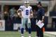 Oct 1, 2012; Arlington, TX, USA; Dallas Cowboys quarterback Tony Romo (9) talks with head coach Jason Garrett during the fourth quarter against the Chicago Bears at Dallas Cowboys Stadium. The Bears beat the Cowboys 34-18. Mandatory Credit: Matthew Emmons-US PRESSWIRE