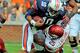 Oct 6, 2012; Auburn, AL, USA; Auburn Tigers quarterback Kiehl Frazier (10) is brought down by Arkansas Razorbacks linebacker Terrell Williams (25) at Jordan-Hare Stadium. Mandatory Credit: Shanna Lockwood-US PRESSWIRE