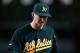 DETROIT, MI - OCTOBER 06: Jarrod Parker #11 of the Oakland Athletics walks towards the dugout after he was taken out of the game in the bottom of the seventh inning against the Detroit Tigers during Game One of the American League Division Series at Comerica Park on October 6, 2012 in Detroit, Michigan. (Photo by Gregory Shamus/Getty Images)