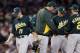 Oct 6, 2012; Detroit, MI, USA; Oakland Athletics starting pitcher Jarrod Parker (11) walks back to the dugout after being relieved in the seventh inning during game one of the 2012 ALDS against the Detroit Tigers at Comerica Park. Mandatory Credit: Rick Osentoski-US PRESSWIRE