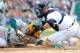 DETROIT, MI - OCTOBER 07: Coco Crisp #4 of the Oakland Athletics is tagged out at home Gerald Laird #9 of the Detroit Tigers in the top of the third inning during Game Two of the American League Division Series at Comerica Park on October 7, 2012 in Detroit, Michigan. (Photo by Jason Miller/Getty Images)