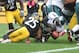 Oct 7, 2012; Pittsburgh , PA, USA; Philadelphia Eagles quarterback Michael Vick (7) fumbles the ball as he is hit by Pittsburgh Steelers safety Ryan Clark (25) during the first half of the game at Heinz Field. Mandatory Credit: Jason Bridge-US PRESSWIRE