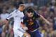 BARCELONA, SPAIN - OCTOBER 07: Lionel Messi of FC Barcelona (R) duels for the ball with Mesut Ozil of Real Madrid CF during the La Liga match between FC Barcelona and Real Madrid CF at Camp Nou on October 7, 2012 in Barcelona, Spain. (Photo by David Ramos/Getty Images)