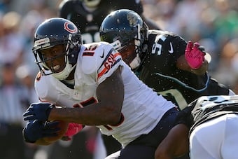 Brandon Marshall fights for extra yardage on one of his 12 receptions in the game against Jacksonville.