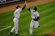 BALTIMORE, MD - OCTOBER 07: Russell Martin (R) #55 of the New York Yankees is congratulated by third base coach Rob Thomson as he scores on his solo home run in the top of the ninth inning against the Baltimore Orioles during Game One of the American League Division Series at Oriole Park at Camden Yards on October 7, 2012 in Baltimore, Maryland. (Photo by Patrick McDermott/Getty Images)