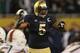 CHICAGO, IL - OCTOBER 06: Manti Te'o #5 of the Notre Dame Fighting Irish calls defensive signals against the Miami Hurricanes at Soldier Field on October 6, 2012 in Chicago, Illinois. Notre Dame defeated Miami 41-3. (Photo by Jonathan Daniel/Getty Images)