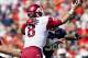 AUBURN, AL - OCTOBER 6: Tyler Wilson #8 of the Arkansas Razorbacks is hit while throwing a pass by Angelo Blackson #98 of the Auburn Tigers at Jordan-Hare Stadium on October 6, 2012 in Auburn, Alabama. The Razorbacks defeated the Tigers 24-7. (Photo by Wesley Hitt/Getty Images)