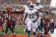 CINCINNATI, OH - OCTOBER 07: Running back Reggie Bush #22 of the Miami Dolphins celebrates after a touchdown with teammates Jake Long #77 and Davone Bess #15 of the Cincinnati Bengals at Paul Brown Stadium on October 7, 2012 in Cincinnati, Ohio. (Photo by Matt Sullivan/Getty Images)