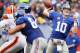 EAST RUTHERFORD, NJ - OCTOBER 07: Quarterback Eli Manning #10 of the New York Giants throws against the Cleveland Browns during their game at MetLife Stadium on October 7, 2012 in East Rutherford, New Jersey. (Photo by Alex Trautwig/Getty Images)
