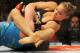 August 18, 2012; San Diego, CA, USA; Sarah Kaufman (blue shirt) and Ronda Rousey (black shirt) during their Strikeforce MMA women's bantamweight title bout at the Valley View Casino Center. Rousey won in 54 seconds of the first round. Mandatory Credit: Jayne Kamin-Oncea-US PRESSWIRE