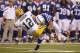 INDIANAPOLIS, IN - AUGUST 26: Aaron Rodgers #12 of the Green Bay Packers gets tackled by Pat Angerer #51 of the Indianapolis Colts during the first half of an NFL preseason game at Lucas Oil Stadium on August 26, 2011 in Indianapolis, Indiana. (Photo by Joe Robbins/Getty Images)