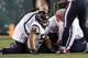 Trainers work on Brian Cushing's knee