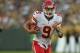 GREEN BAY, WI - AUGUST 30: Brady Quinn #9 of the Kansas City Chiefs runs for a first down against the Green Bay Packers during a preseason game at Lambeau Field on August 30, 2012 in Green Bay, Wisconsin. (Photo by Jonathan Daniel/Getty Images)